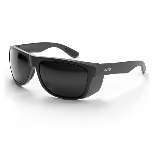 Rapids safety glasses with matte black frame and tinted lens at an angle