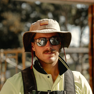 Fusions safety glasses with graphite frame and mirror chrome lens, front view.