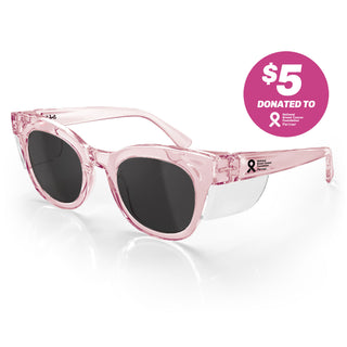 Harps safety glasses with pink frame and grey polarised lens at an angle