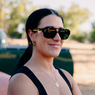 Skylines Black Frame Prescription Safety Glasses, front view, on a face, with temples and lenses visible.