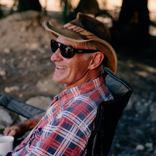 Skylines Black Frame Prescription Safety Glasses, front view, on a face, with temples and lenses visible